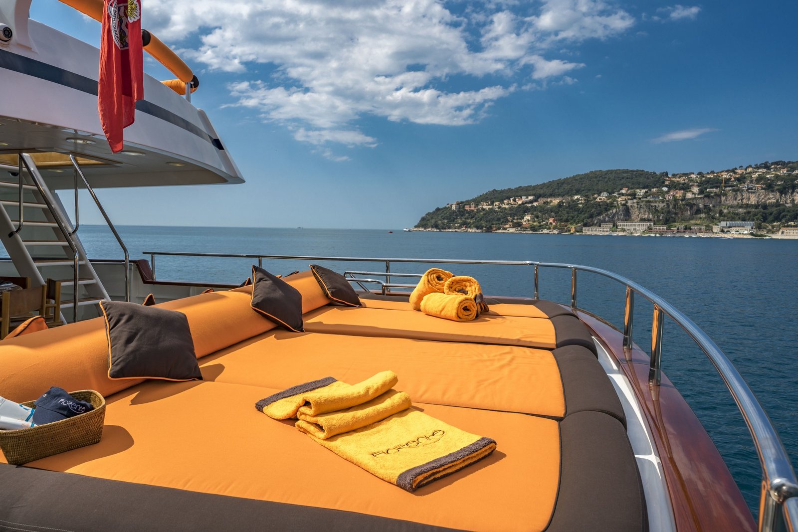 Aft deck sunpad — Fiorente-branded towels, views over Villefranche