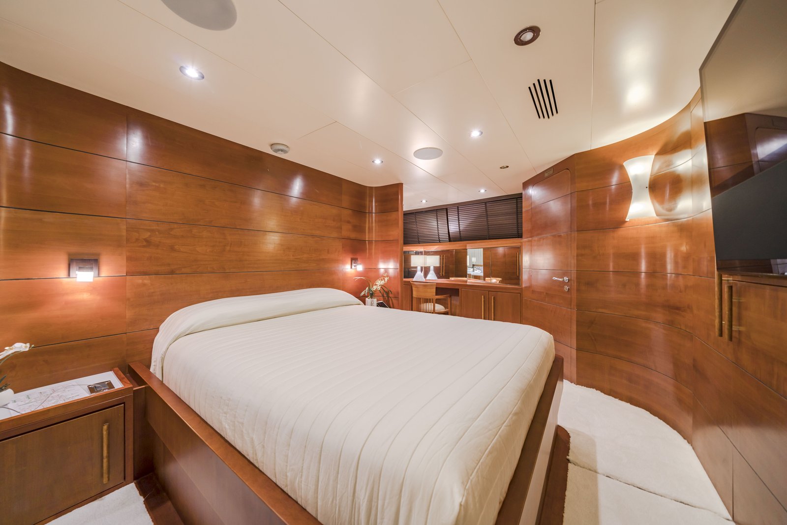 Master stateroom of Fiorente — walnut panelling with original artwork