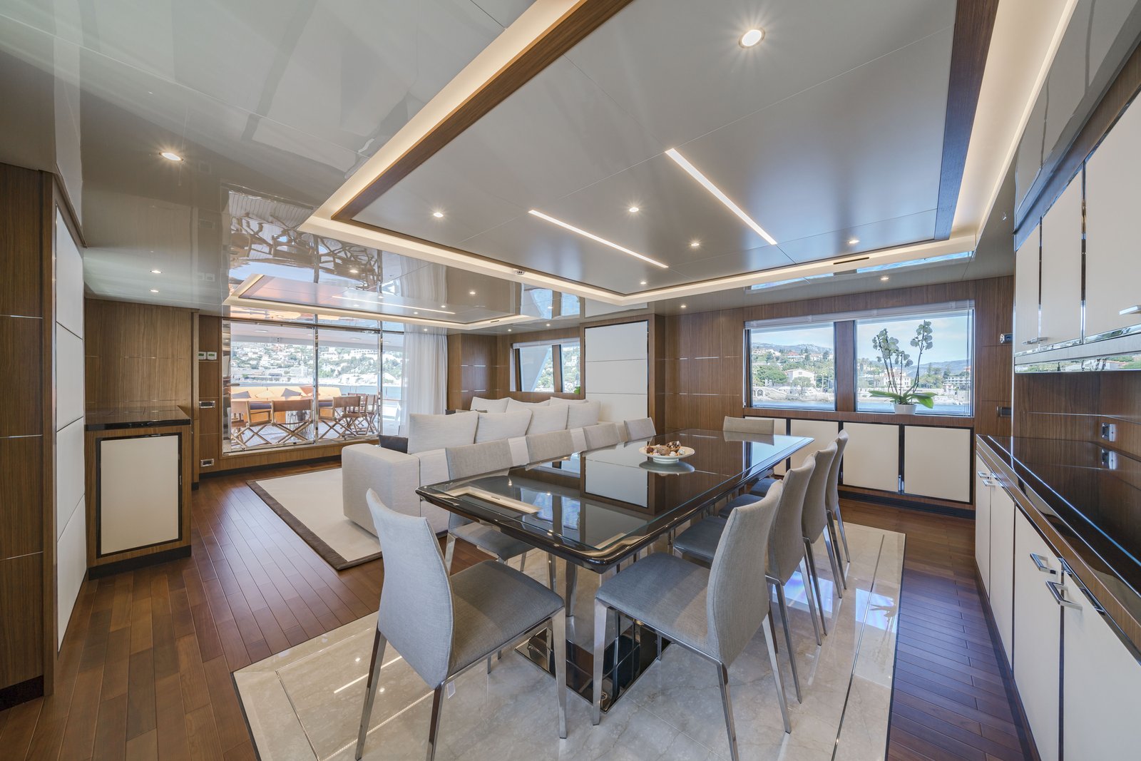 Sky lounge with aft deck visible through glass doors