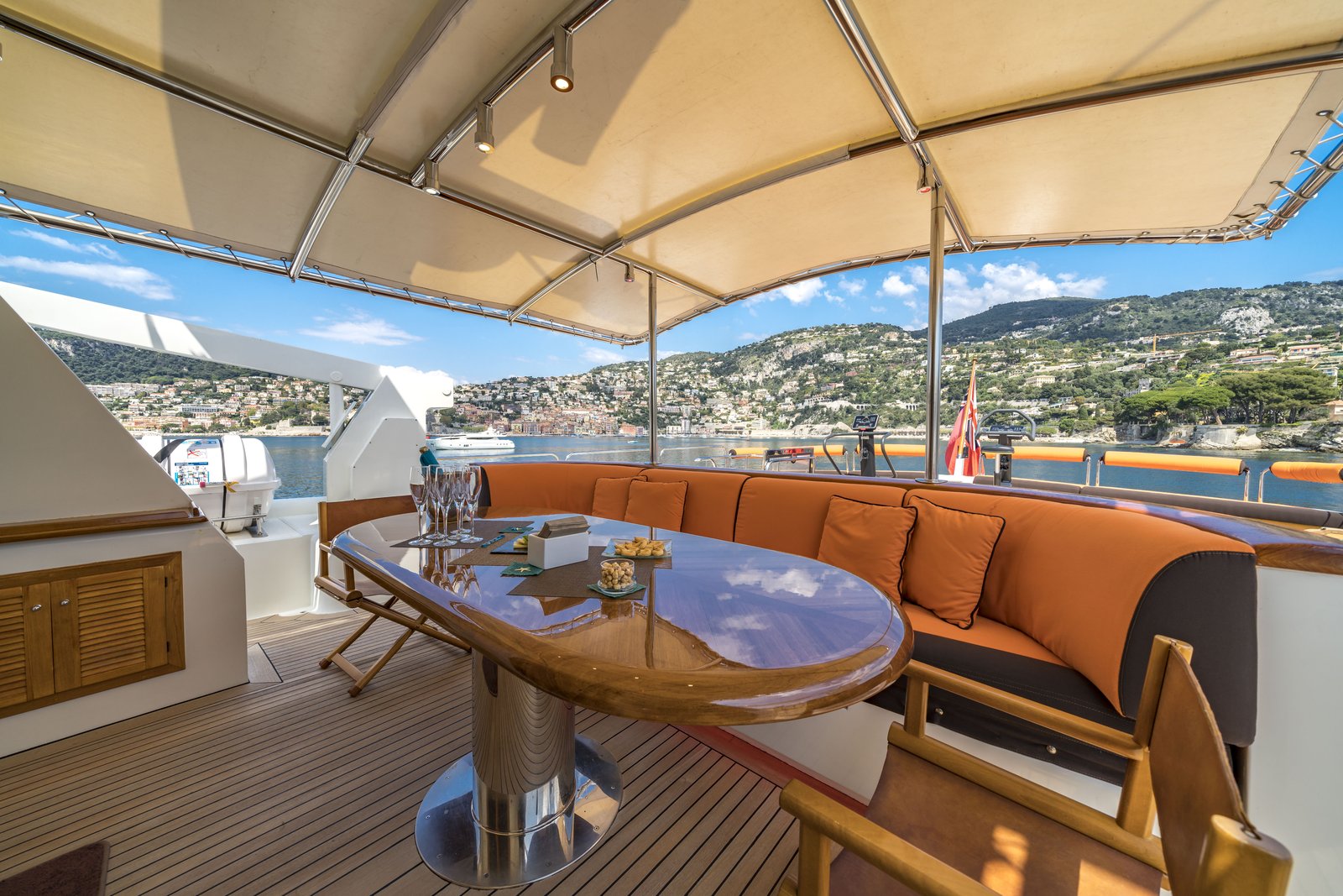 Sundeck looking aft — orange loungers and the coast from above