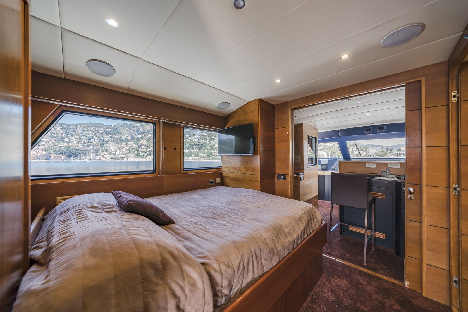 Upper deck cabin — door opens directly to the bridge