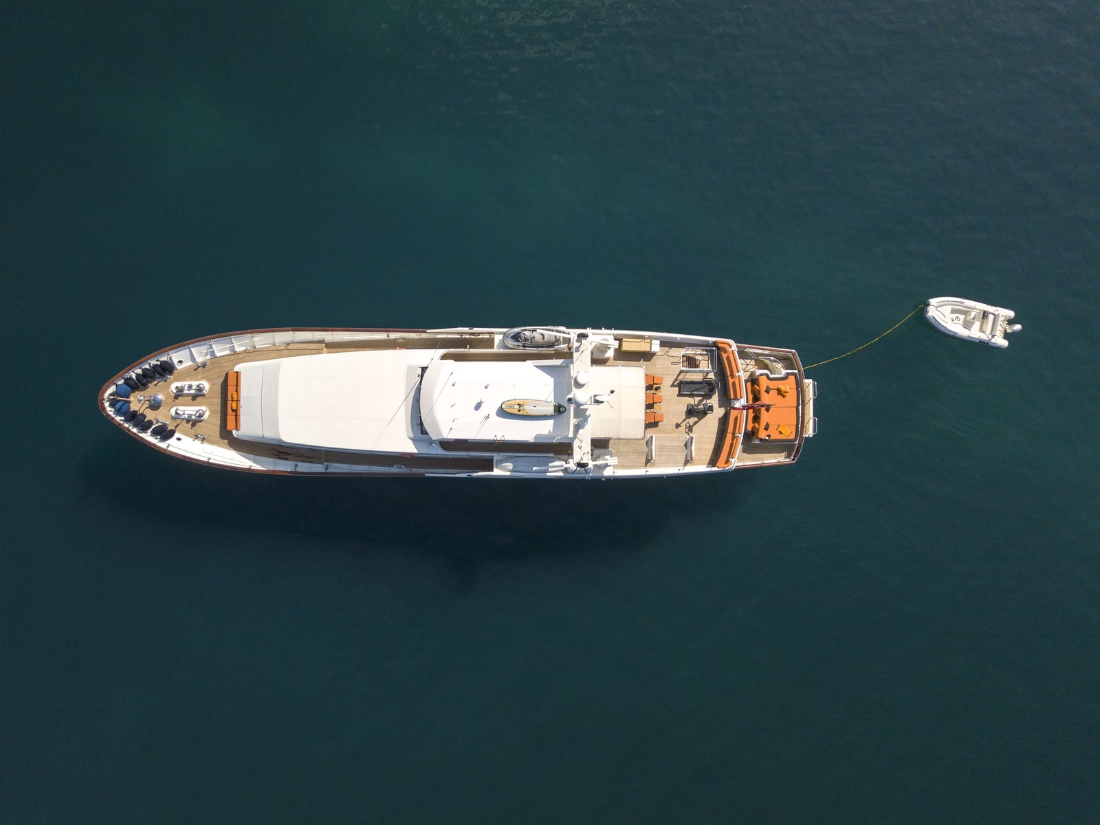Fiorente from directly overhead, at anchor with tender trailing